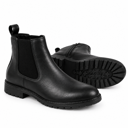 A pair of black leather Chelsea boots with elastic side panels and lug soles, shown on a clean white background.