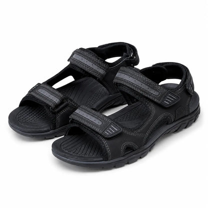 A pair of black athletic sandals with three adjustable hook-and-loop straps, shown on a clean white background.